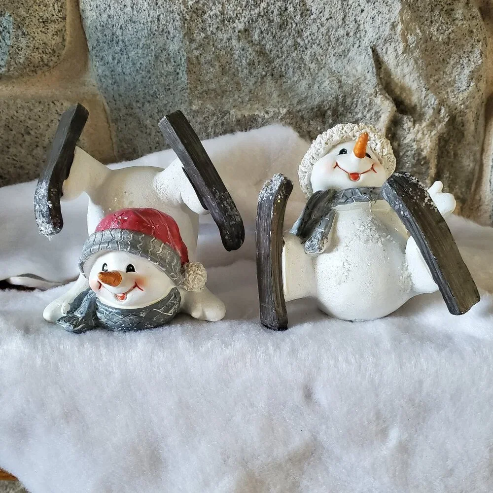 2 Skiing Snowman Figurine's